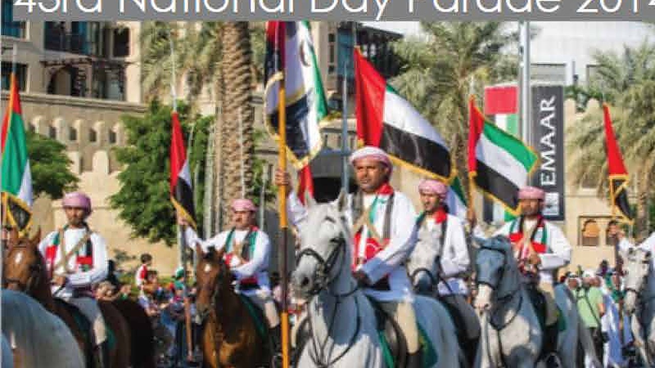Horse riders with UAE flags at the Downtown Dubai parade